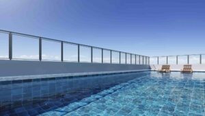 Piscina com deck molhado no Rooftop do Nex One Artur Prado. Vista 180o de toda a região da Av. Paulista